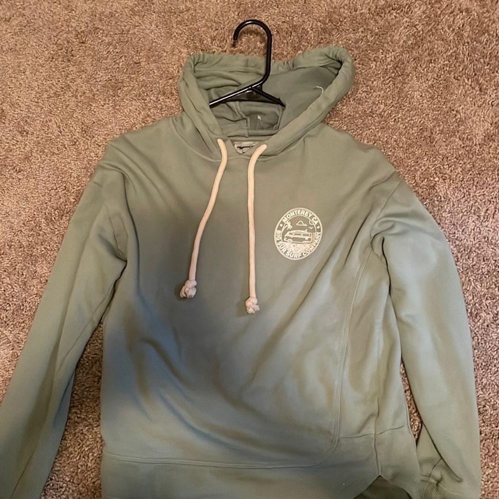 Medium, green, light fabric, hoodie.